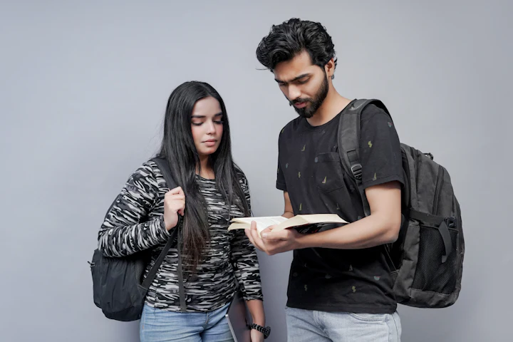 Two students going through notes together